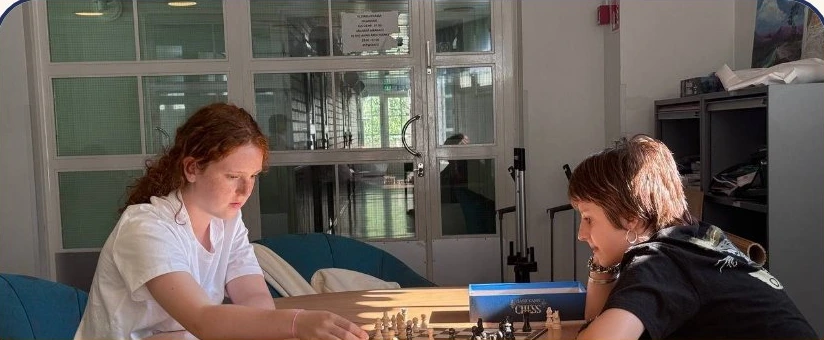 Two campers considering a board game